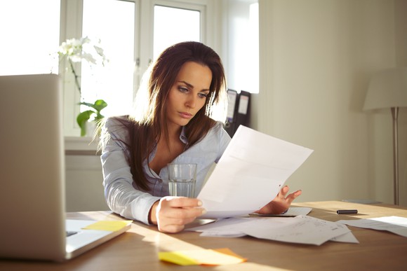 Woman looking through documents.