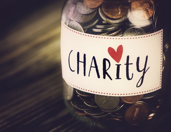 Jar of coins labeled "charity"