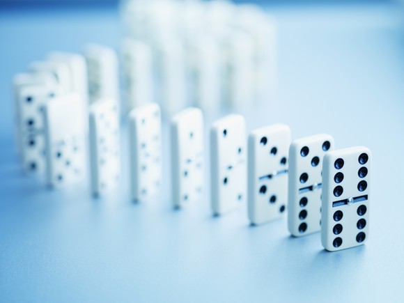 Dominoes set up, ready to fall
