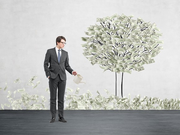 A businessman plants a "money tree."