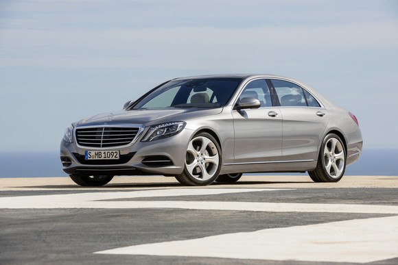 A silver Mercedes-Benz S-Class sedan parked on a roadway.