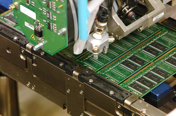 A semiconductor die-cutting machine working on an assembly line in one of Micron Technology's factories