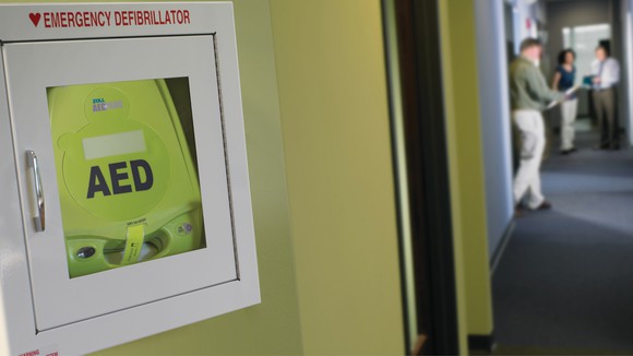 AED device installed in a wall.