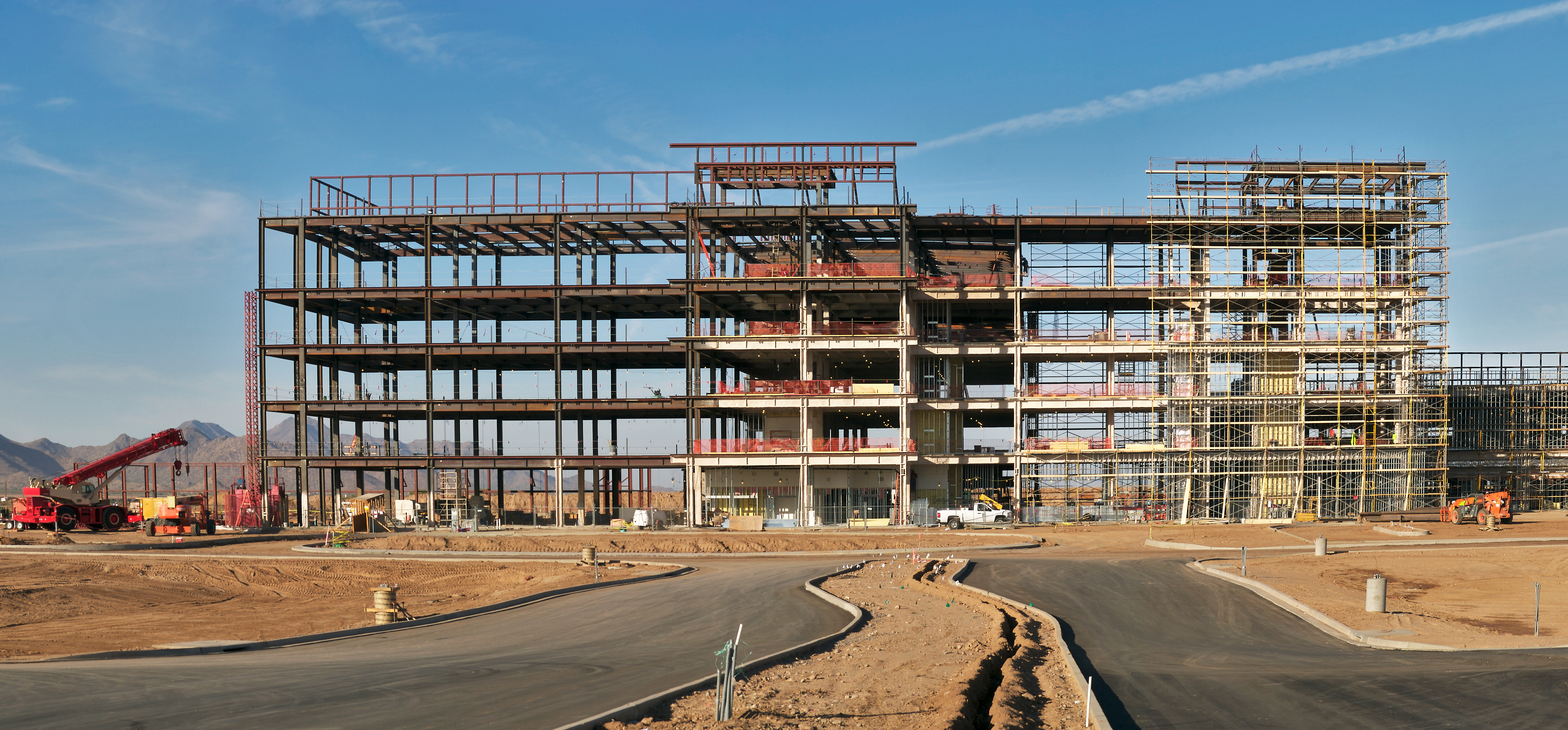 A commercial construction site showing the skeleton of a building