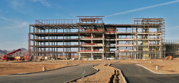 A commercial construction site showing the skeleton of a building