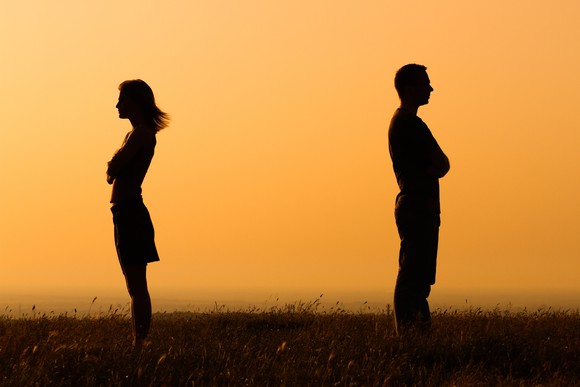 Married couple facing apart.