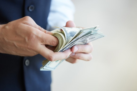 businessman counting bills