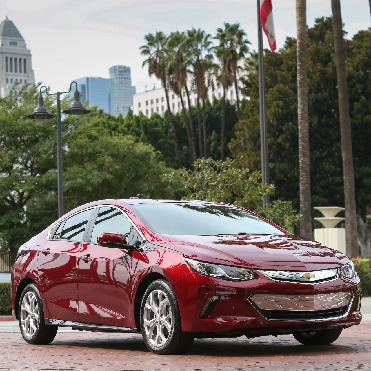 A red Chevrolet Volt sedan.