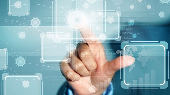 A hand touches a virtual square.