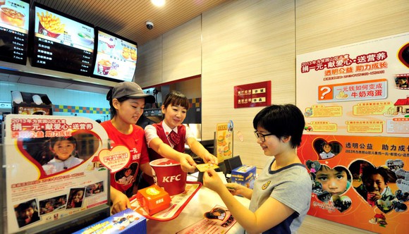 Customer picking up order at KFC in China.