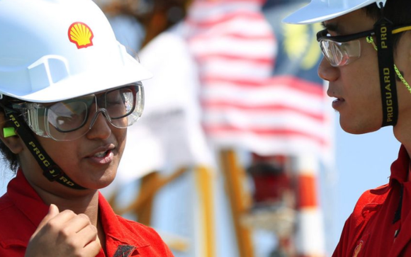 Royal Dutch Shell employees talking.