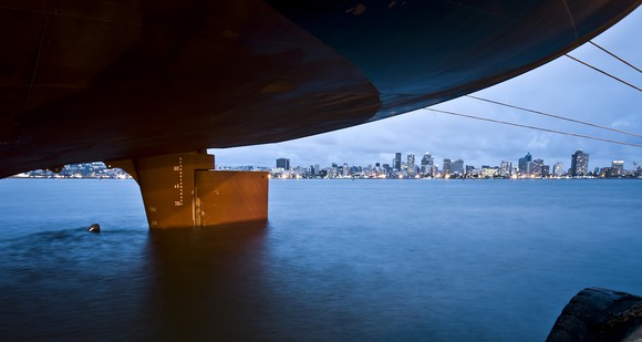 Ship hull riding high on water.
