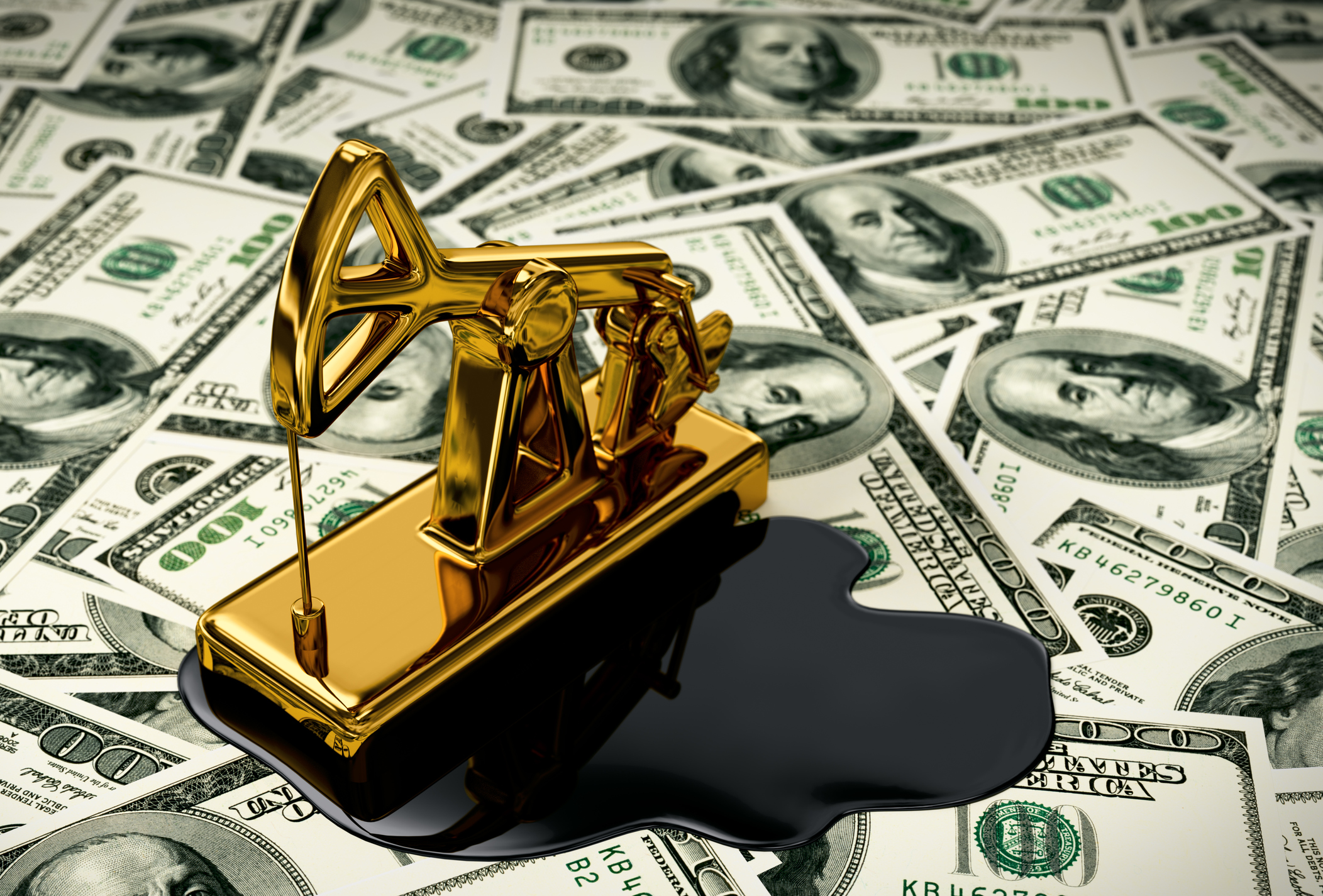 A golden pumpjack and spilled oil on dollars.