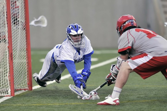 Two lacrosse players.