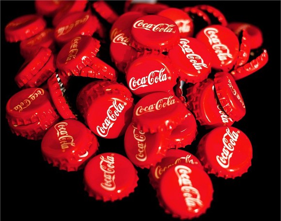 A pile of Coca-Cola bottle caps.