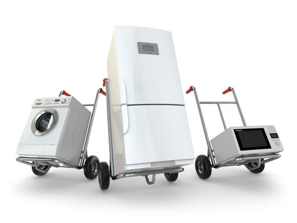 An assortment of appliances on handtrucks