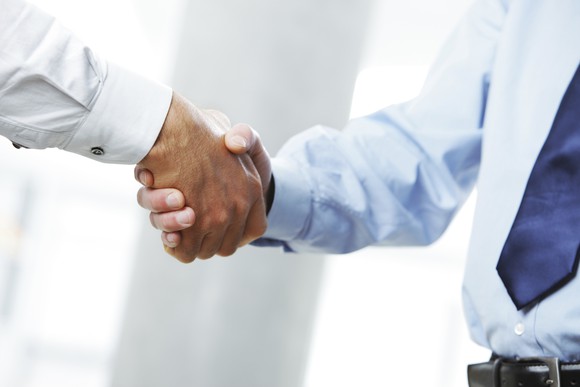 Men shaking hands.