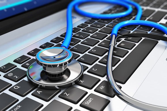 A stethoscope sitting on a keyboard.