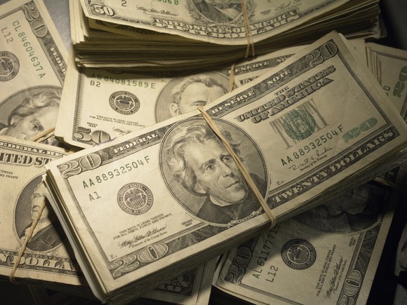 Stacks of cash in rubber bands.