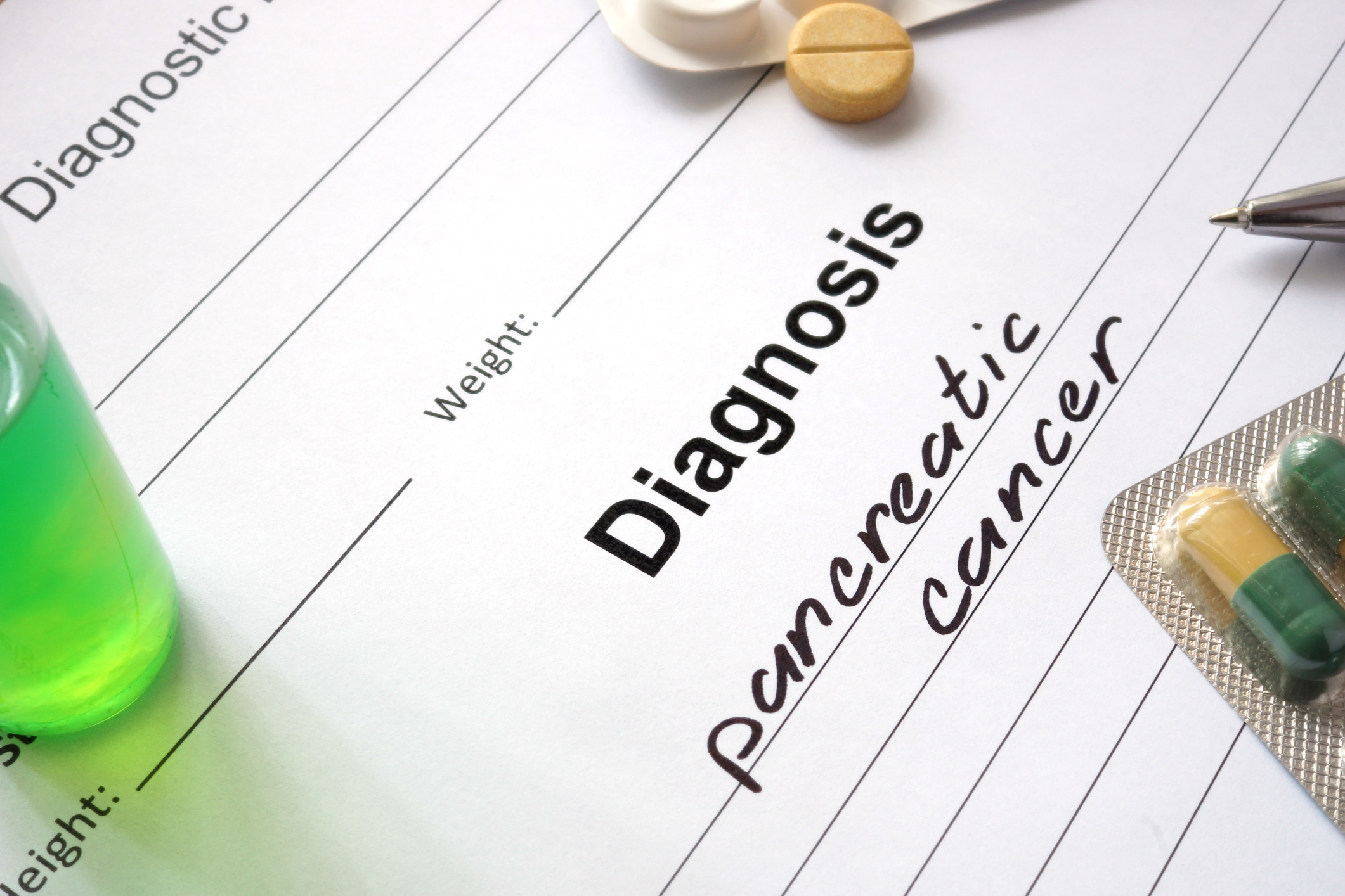 Paper with "Diagnosis: pancreatic cancer" written on it