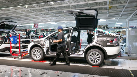 Model X being assembled in Tesla's vehicle factory.
