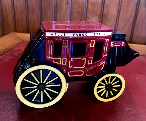 Toy stagecoach with Wells Fargo name.