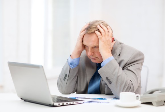 Stressed out man at his computer