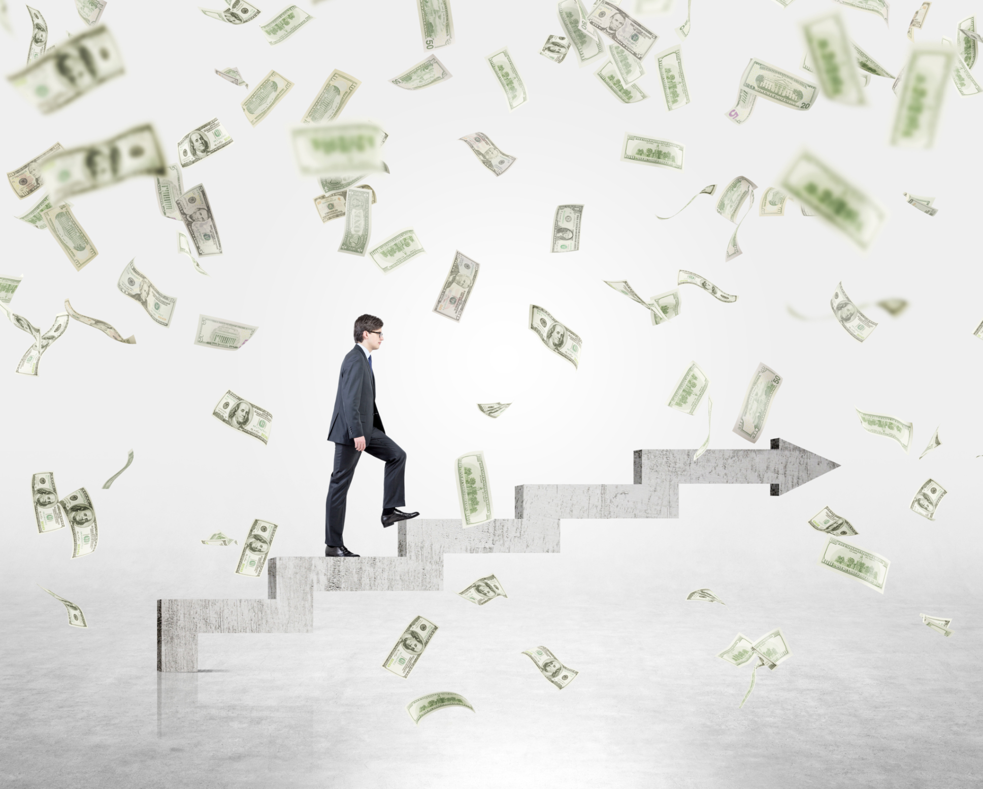 A businessman walking up steps with money falling all around him, indicative of management taking steps forward to generate more profits for a company.