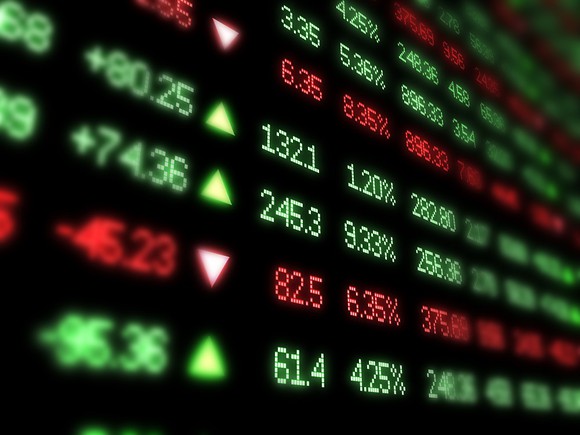 Stock prices on a digital board.