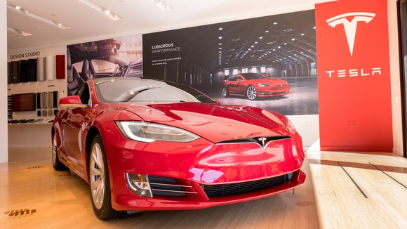 Red Model S in a Tesla store.