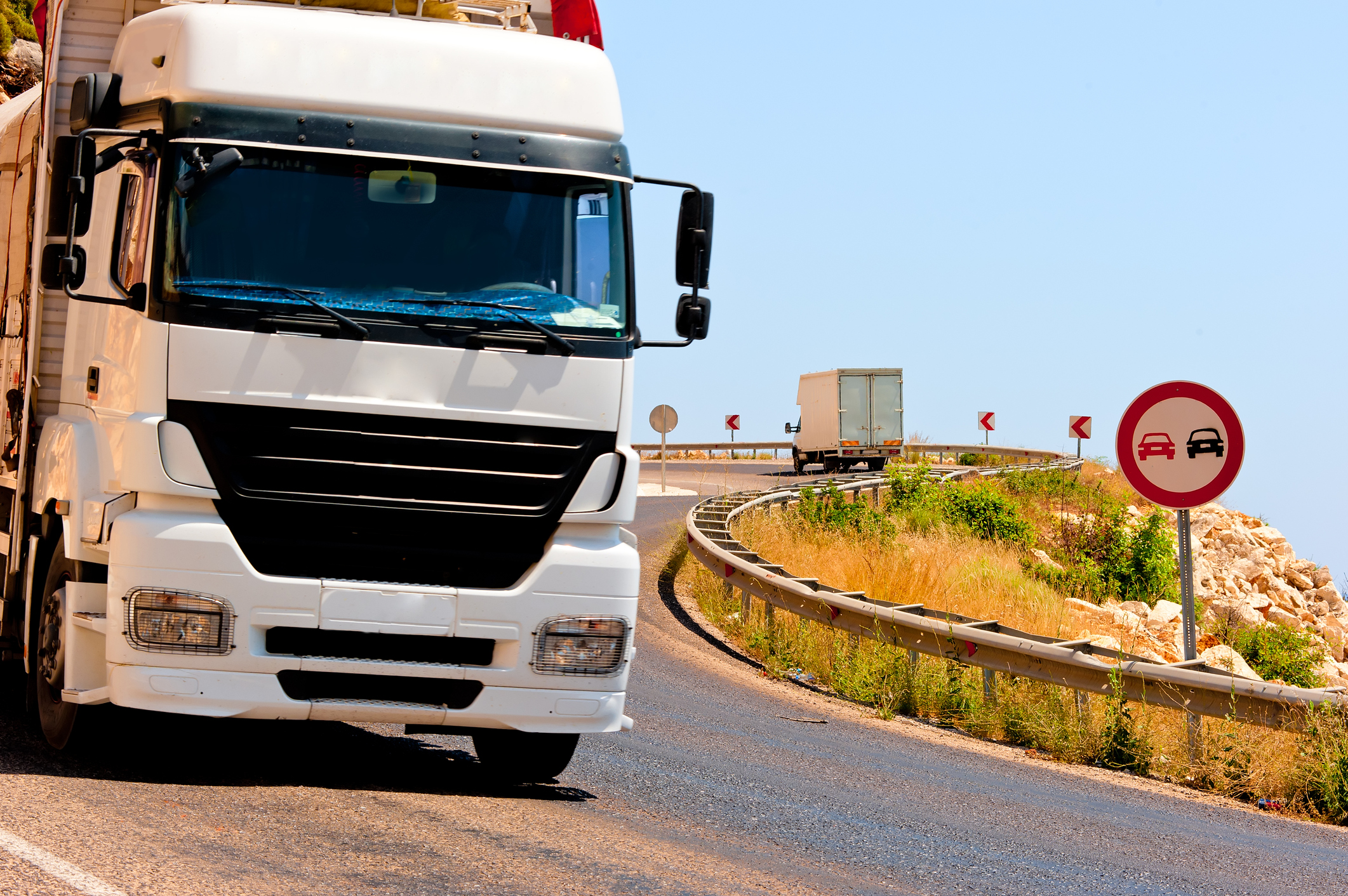 Semi truck driving downhill.