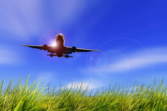 Airplane flying against blue sky