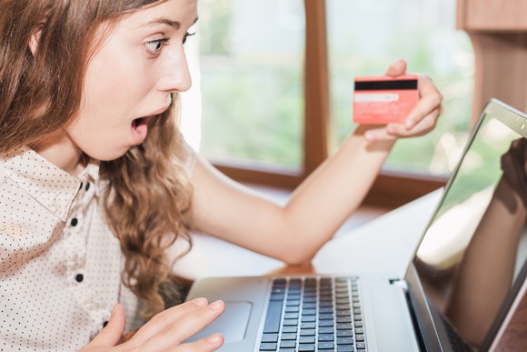 A woman checking out her credit score on her laptop.