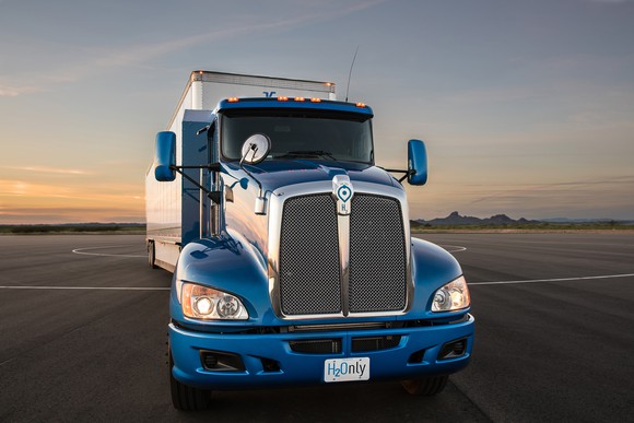 A blue tractor-trailer truck.