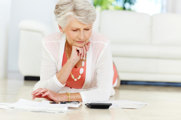 Senior woman reviewing her budget