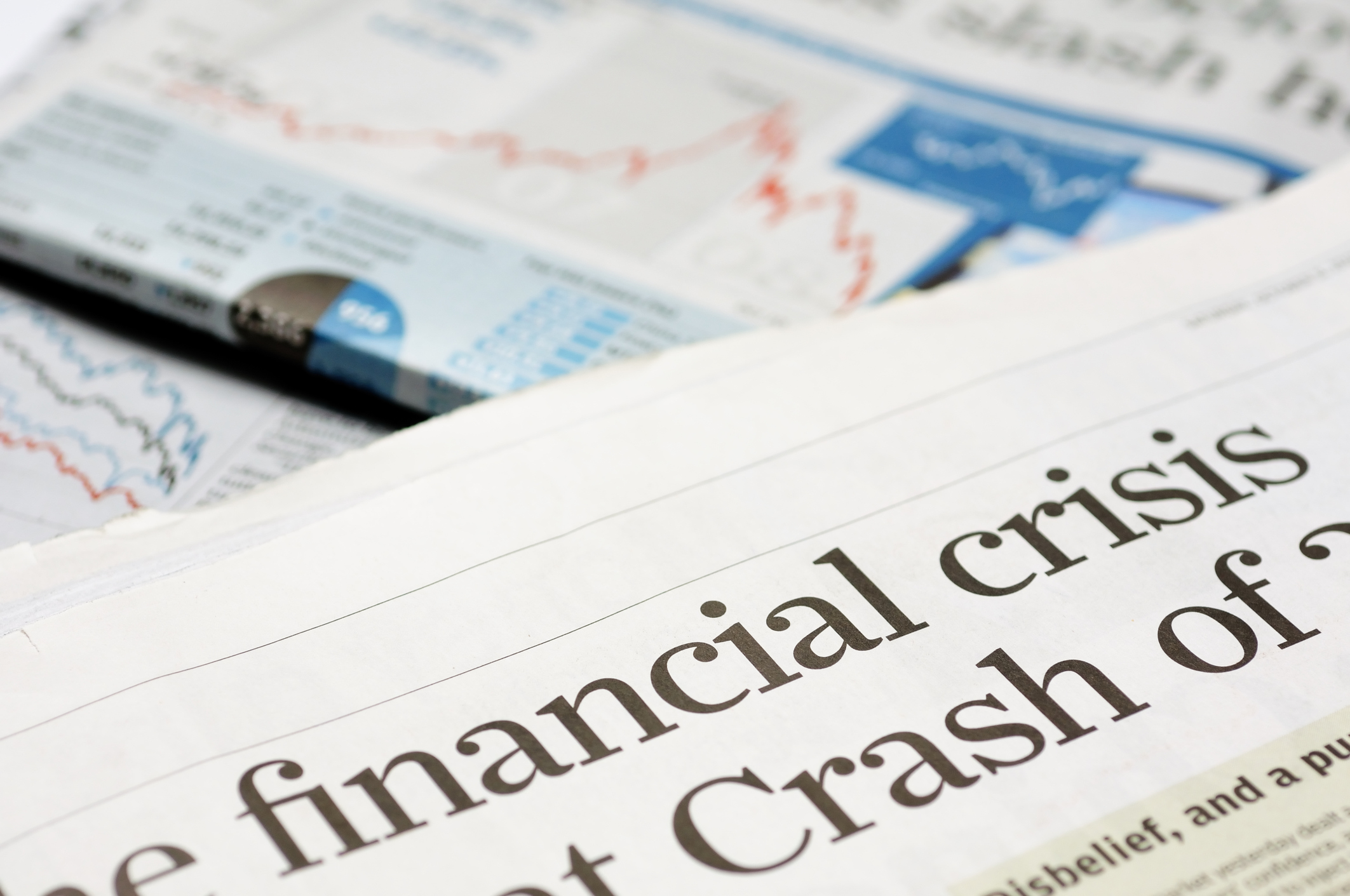 Newspaper headline that reads "financial crisis".