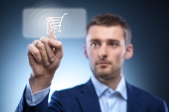 Man touching shopping cart button