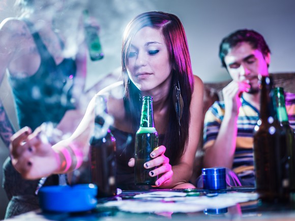 Friends getting together at home drinking and smoking