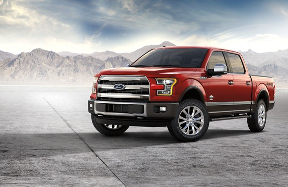 A red Ford F-150 King Ranch pickup.