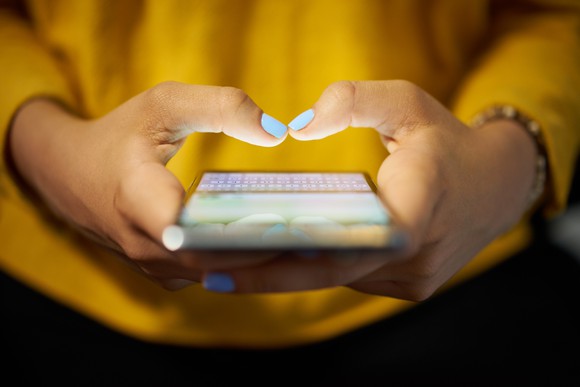 Woman using a smartphone messaging app