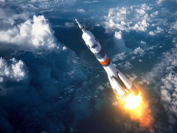 A rocket soars into outer space.