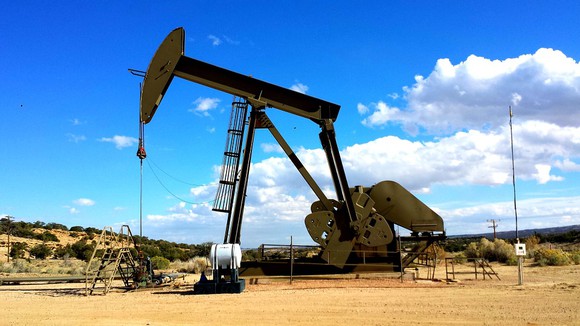 A pumpjack operating during the daytime.