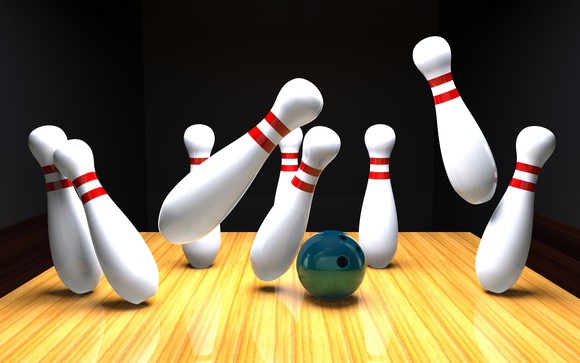 Bowling pins knocking each other over.