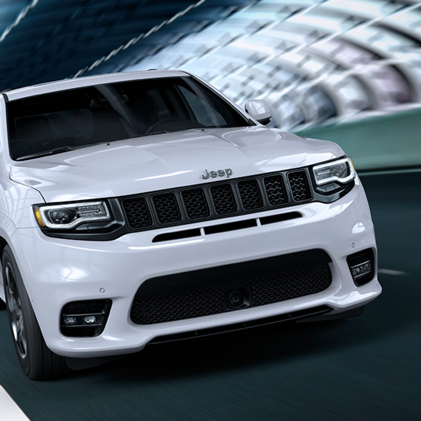 A white Jeep Grand Cherokee SRT