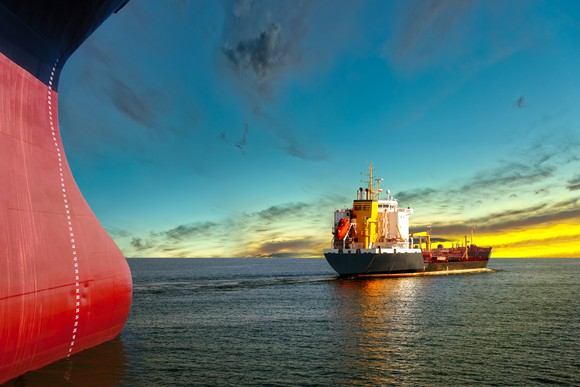 Tanker ships at sunset.