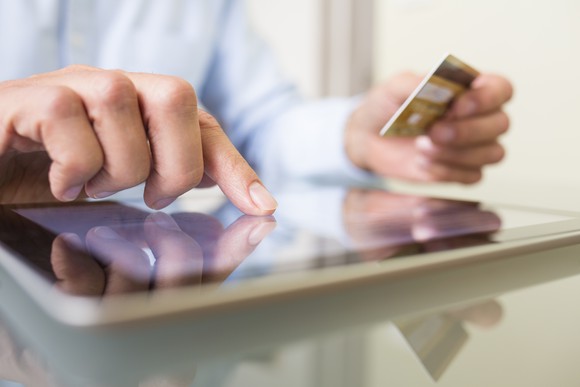 Man with tablet and credit card