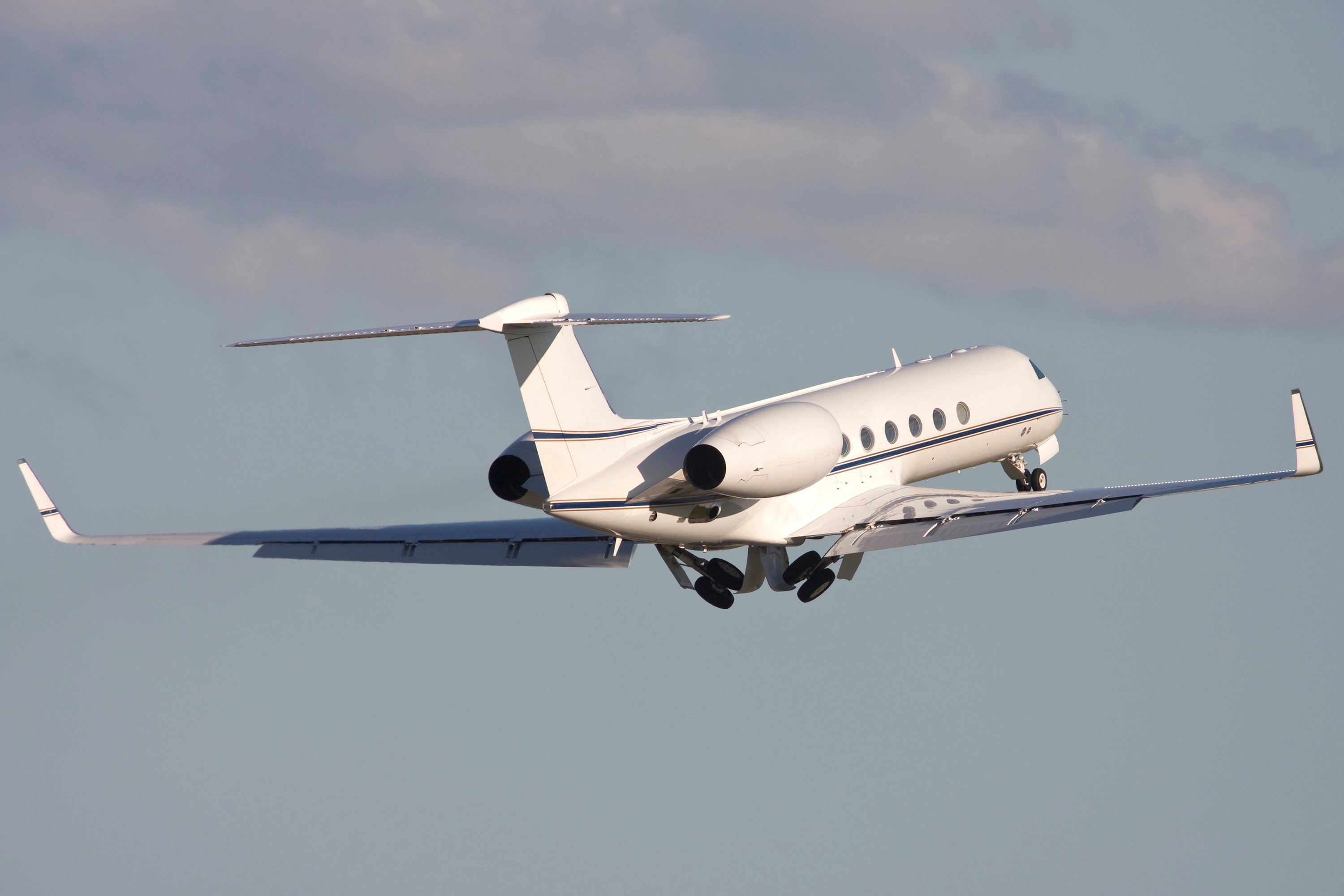 A Gulfstream business jet in the air.