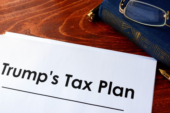 A stack of papers on a desk with the words "Trump's tax plan" on top