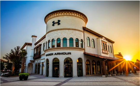 Sun rising over Under Armour "Brand House" retail store.