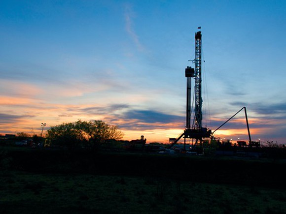 Drilling rig in silhouette